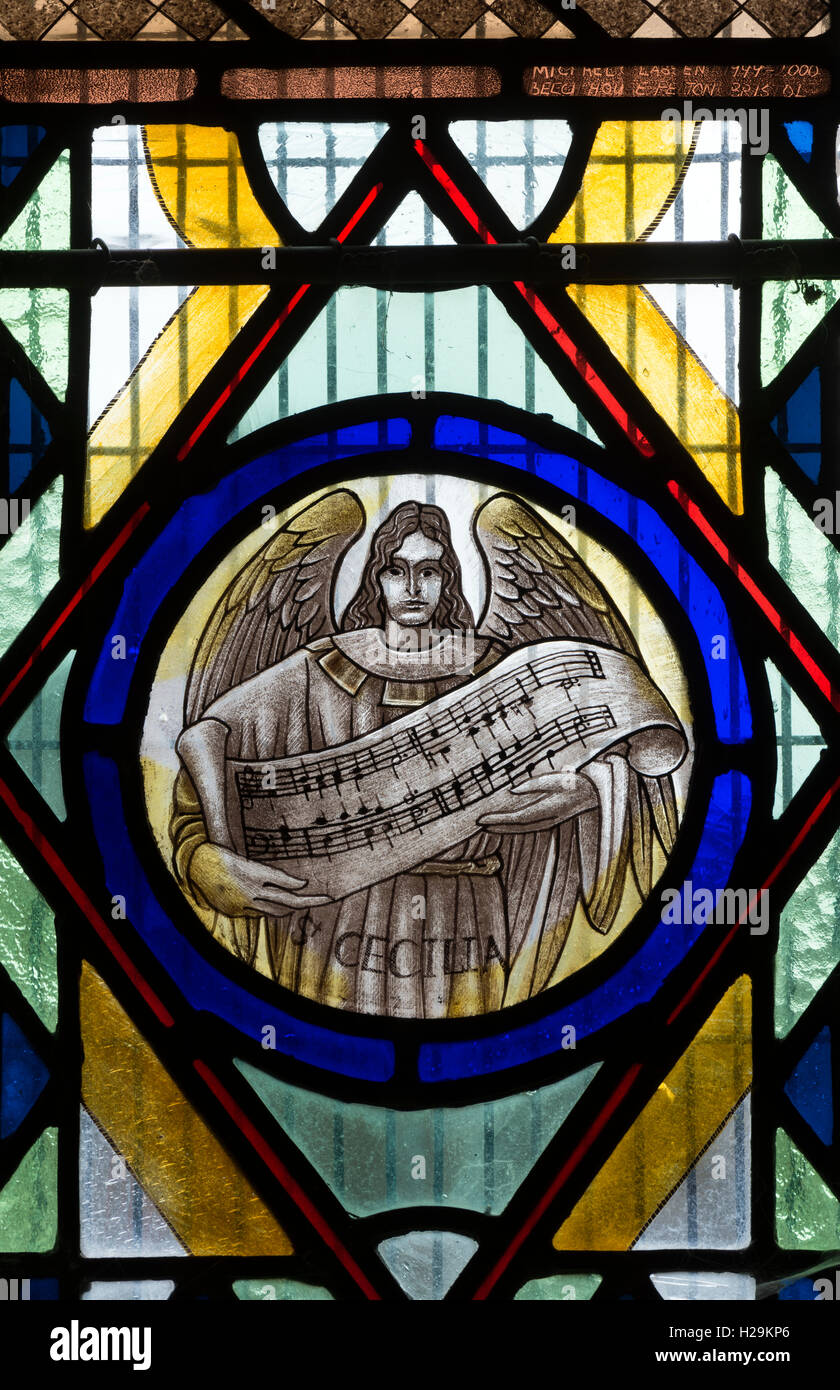 Saint Cecilia stained glass, St. Bartholomew`s Church, Ducklington, Oxfordshire, England, UK Stock Photo